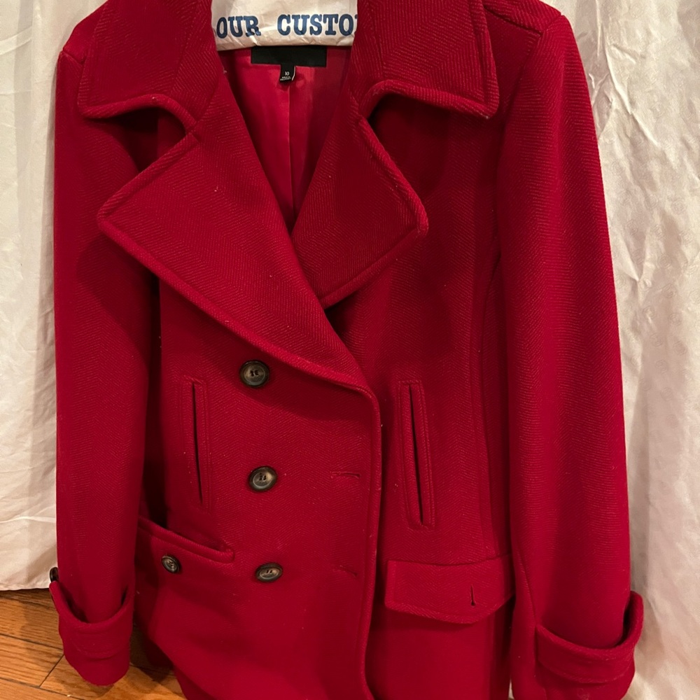 Call ladies size medium car coat falls below the waist